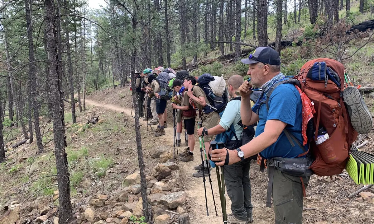 Adult leaders accompanying Troop 826 Scouts on a backpacking trail