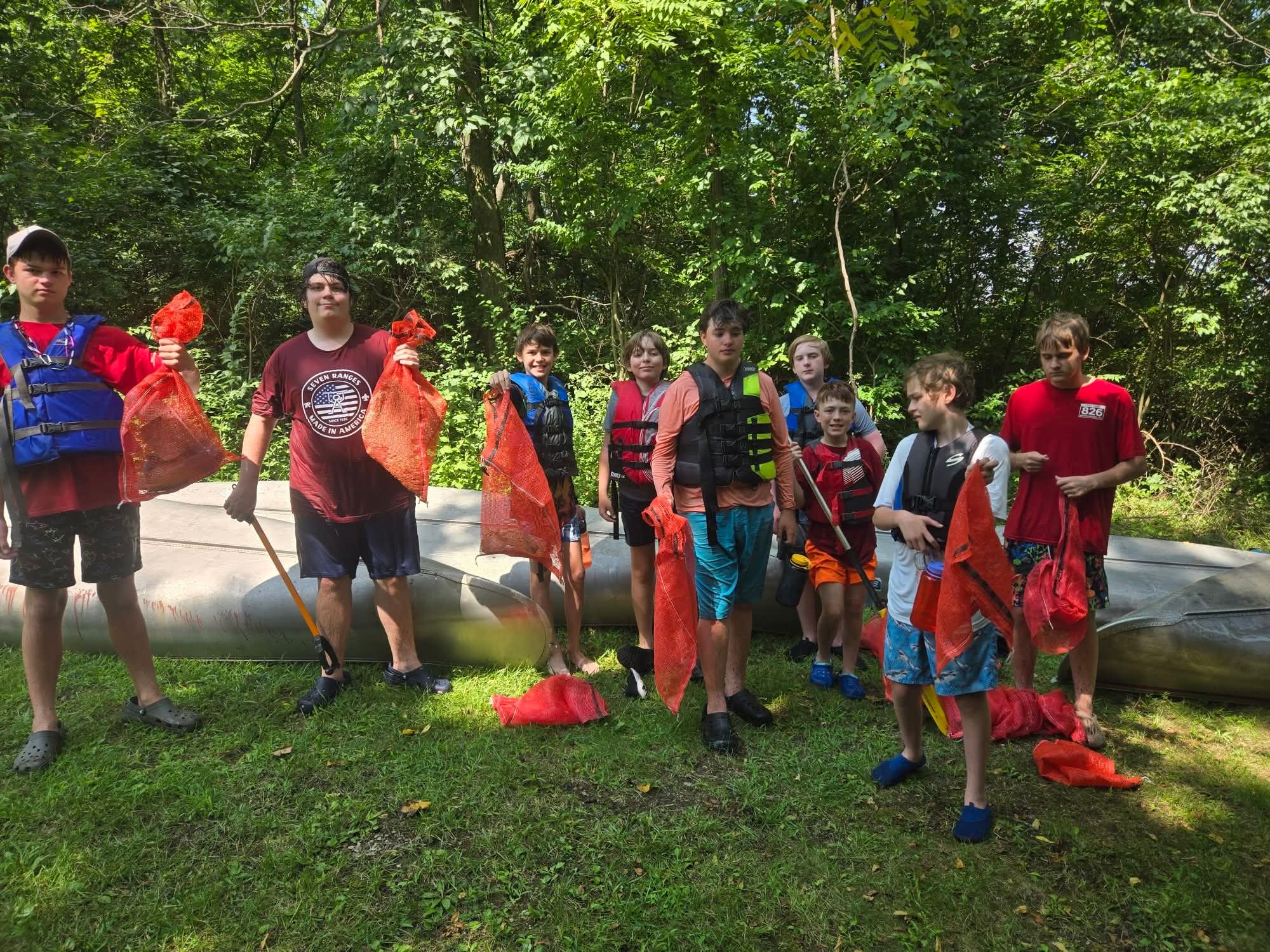 Troop 826 Scouts caring for troop canoes during a service project