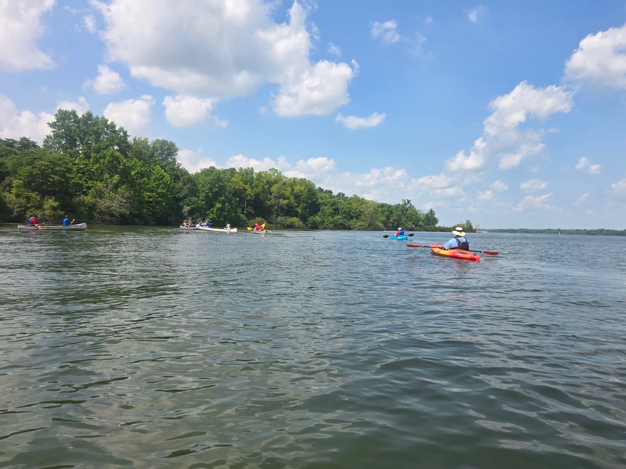 Troop 826 Scouts paddling together across a lake