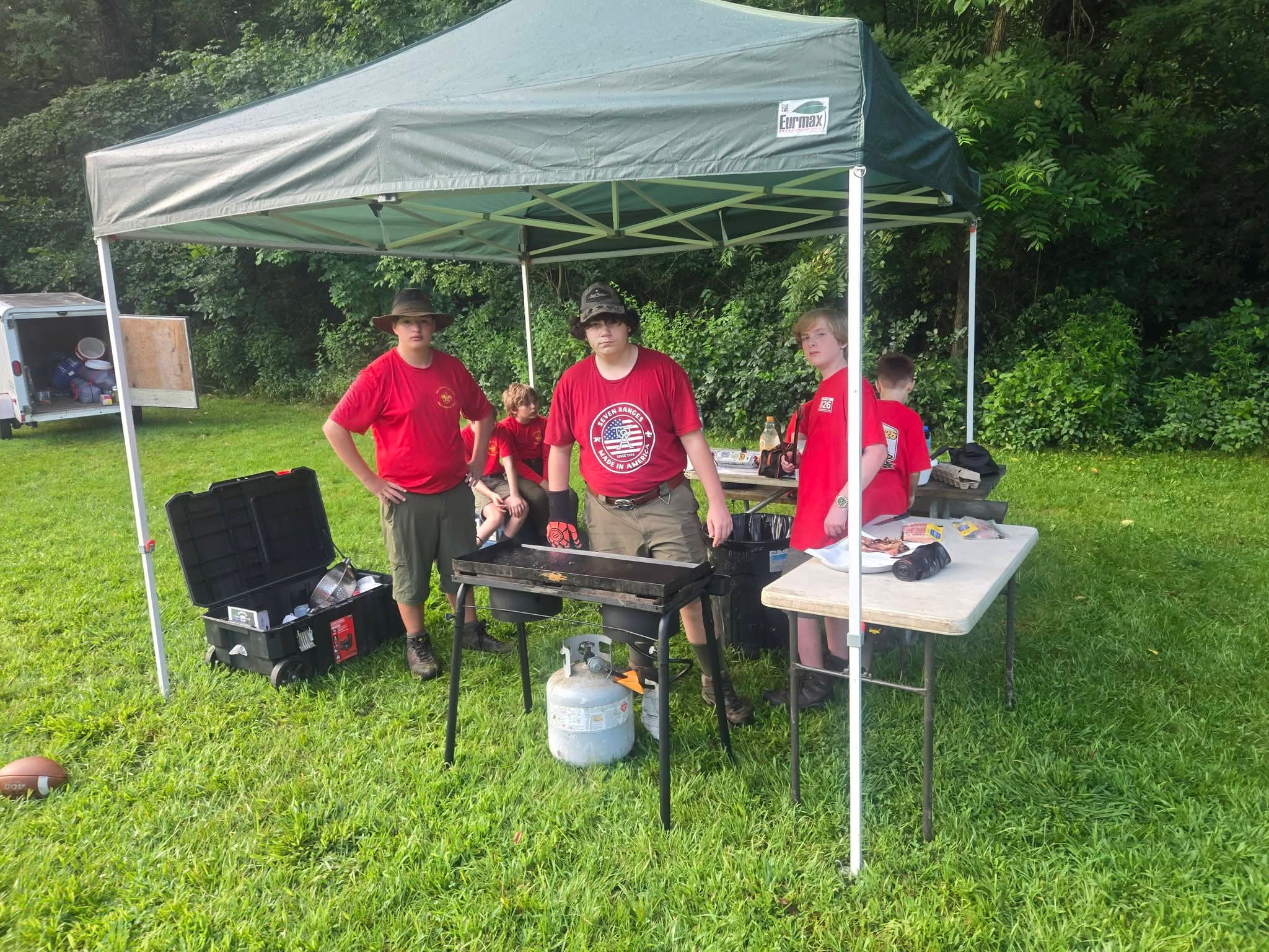 Troop 826 Scouts preparing food together outdoors