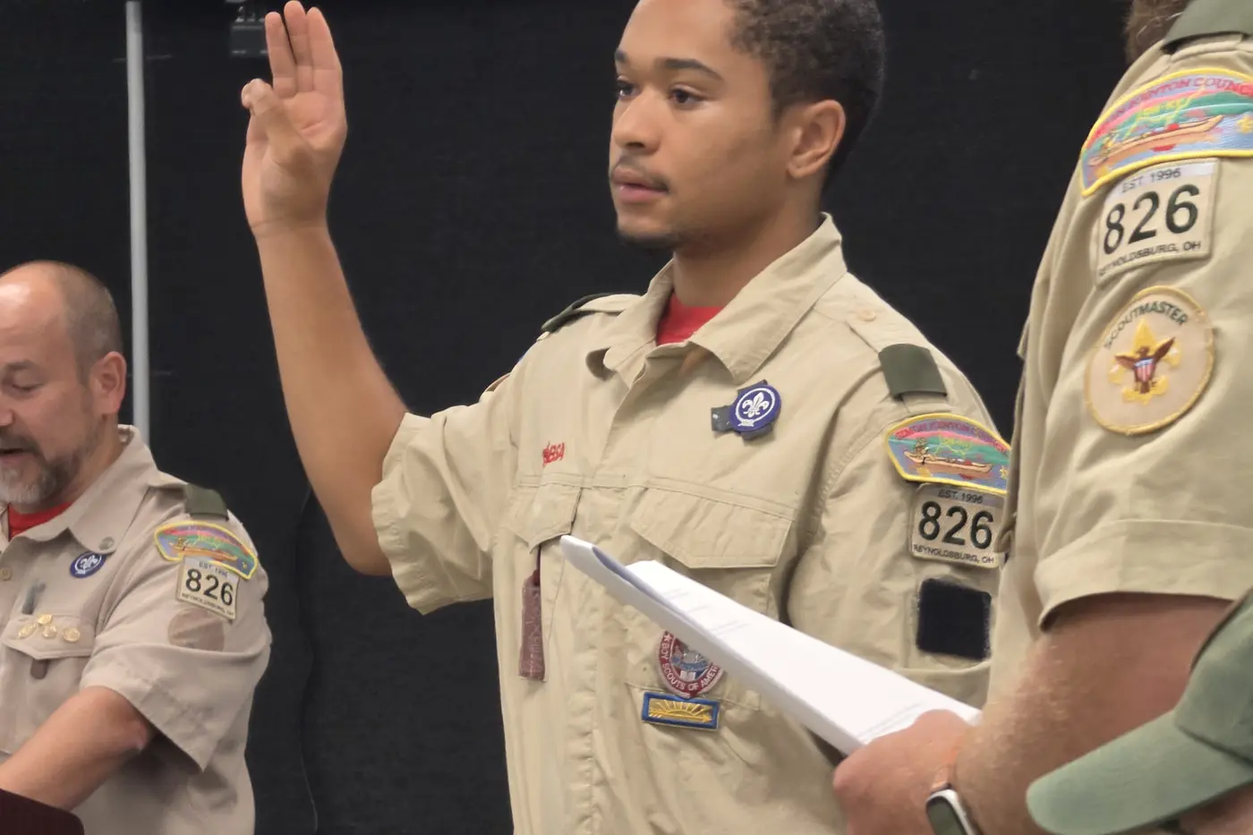 A Troop 826 Scout speaking at a community gathering