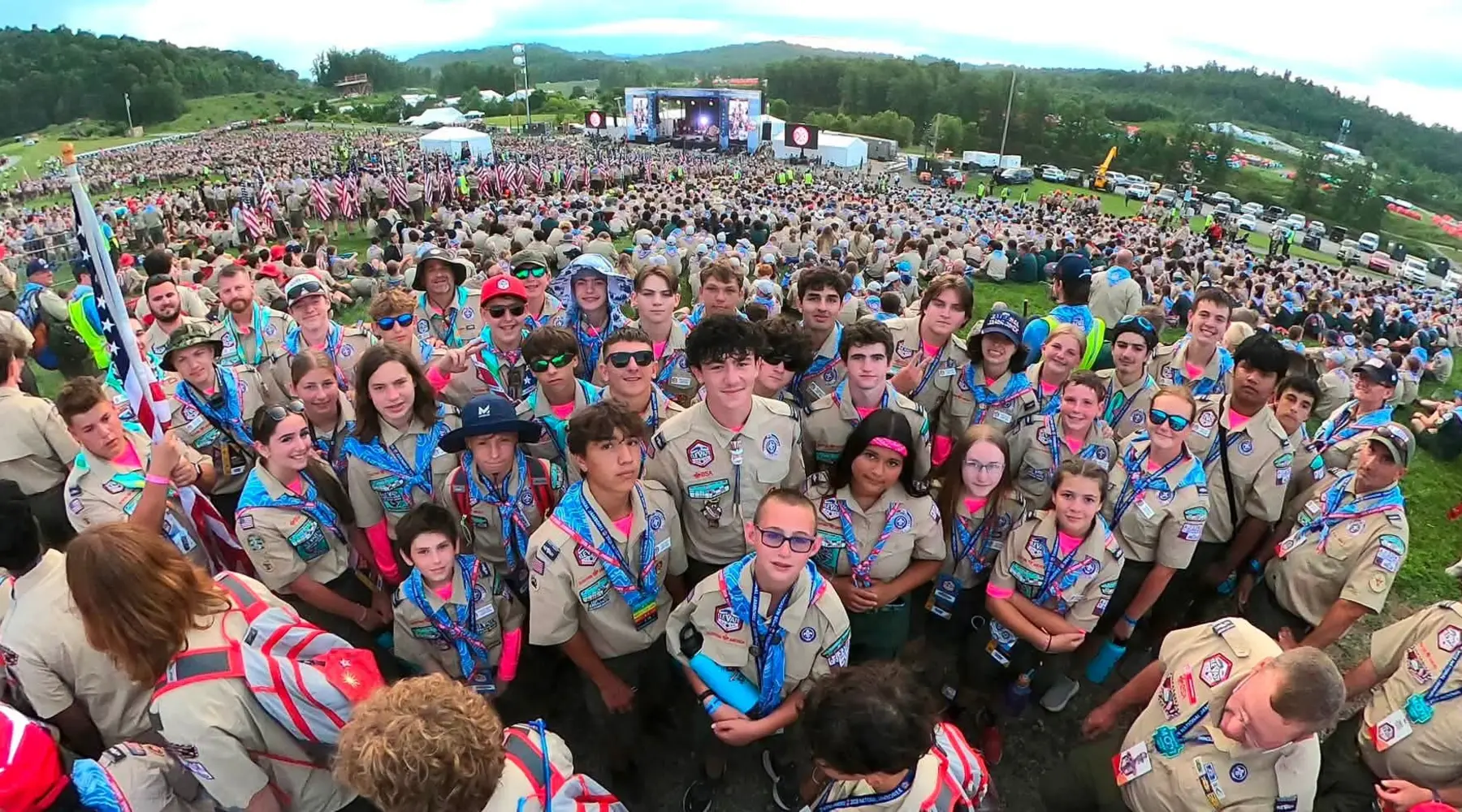 A large gathering of Scouts at an outdoor Scouting event