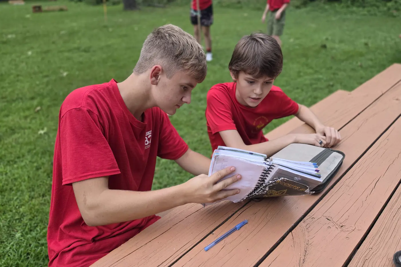 Scouts working together with activity materials