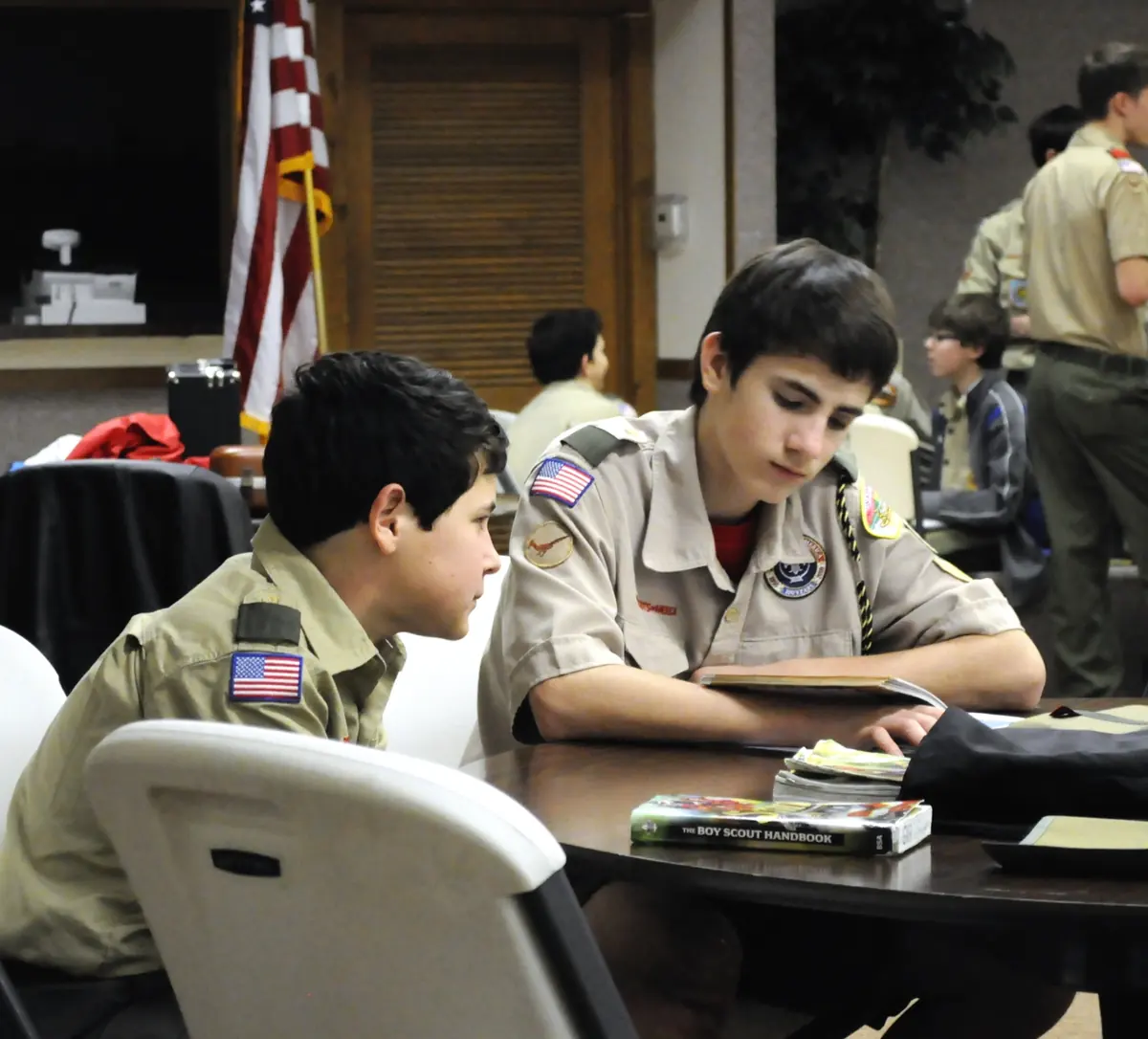 Troop 826 Scouts working together at a Thursday meeting