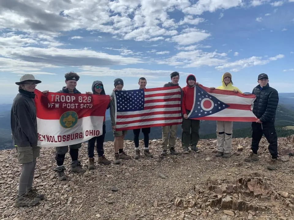Troop 826 Scouts carrying the troop, United States and Ohio flags on a mountain