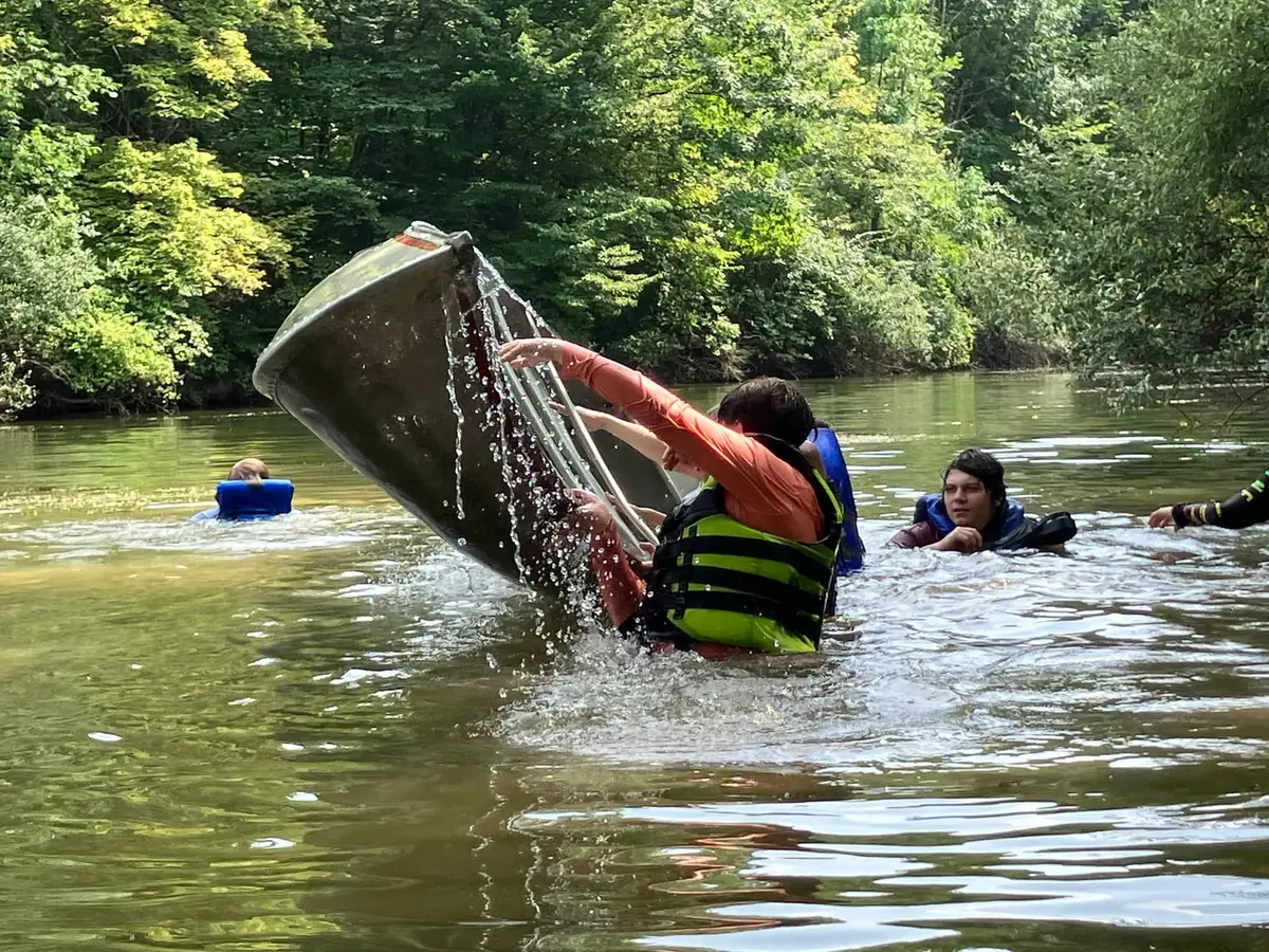 Scouts practicing canoe recovery